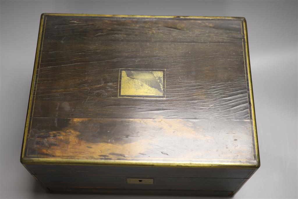 A 19th century brass bound coromandel fitted vanity case and contents, length 31cm